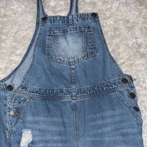 Women’s blue overalls with rips